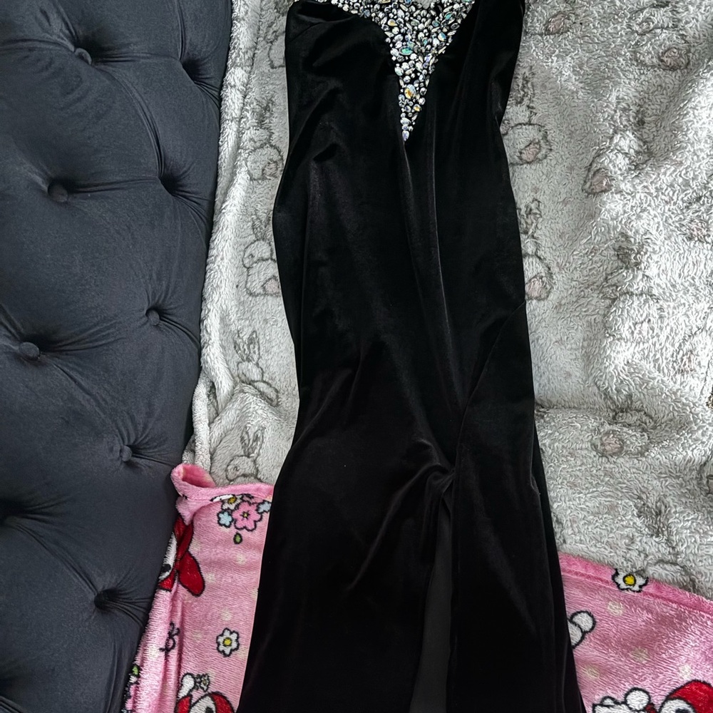 Brand new with tags! Black gown, has leg split.